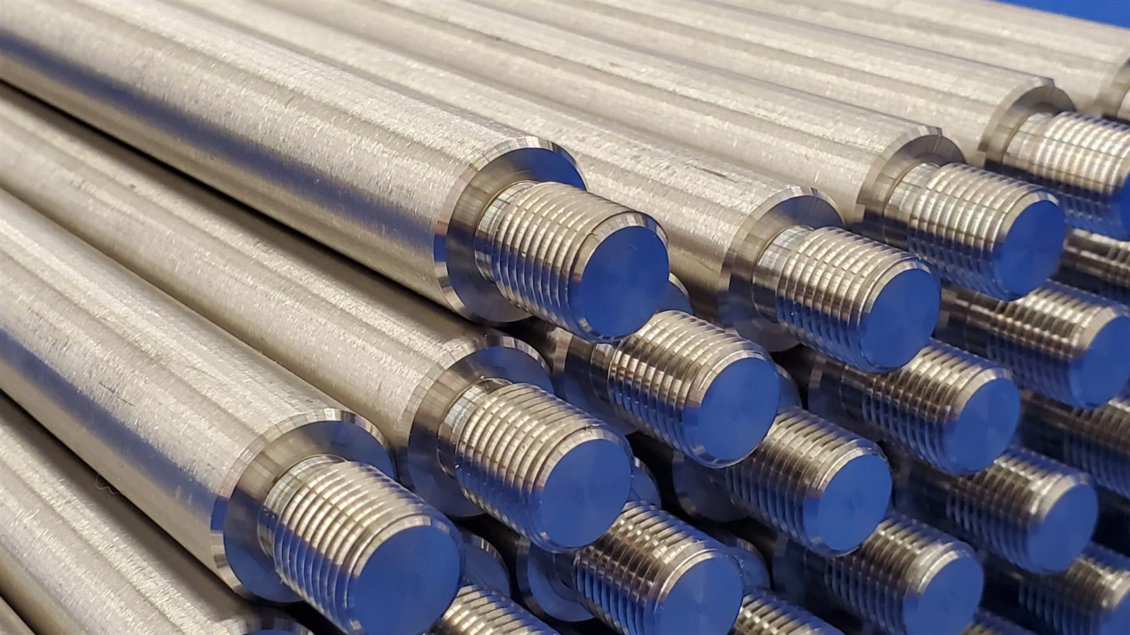 Close view of machined threads on a batch of turned components